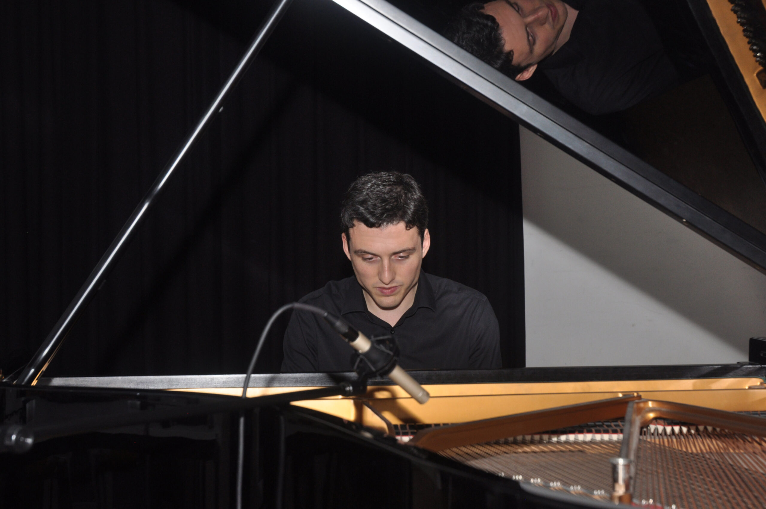Harris Gegich playing piano